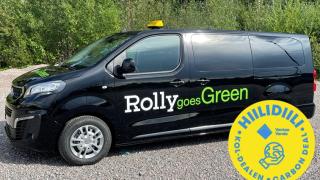 RollygoesGreen musta täyssähkötila-auto. Hiilidiili logo.