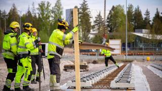 Rails are being installed in the picture.