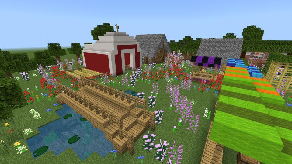 Kuvakaappaus Minecraftista. Palikoista rakennettu talo ja silta.